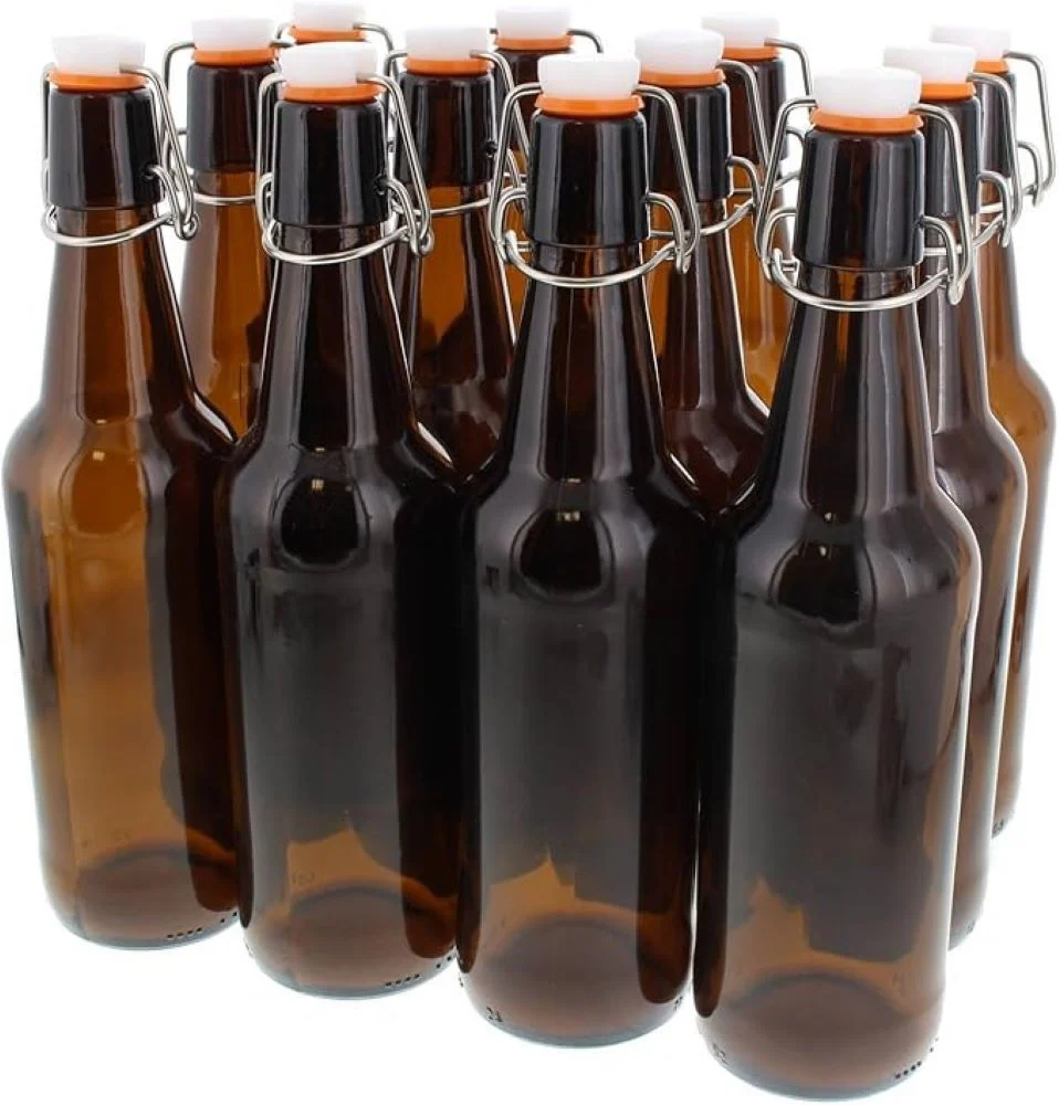 Brown glass bottles with swing caps arranged together.